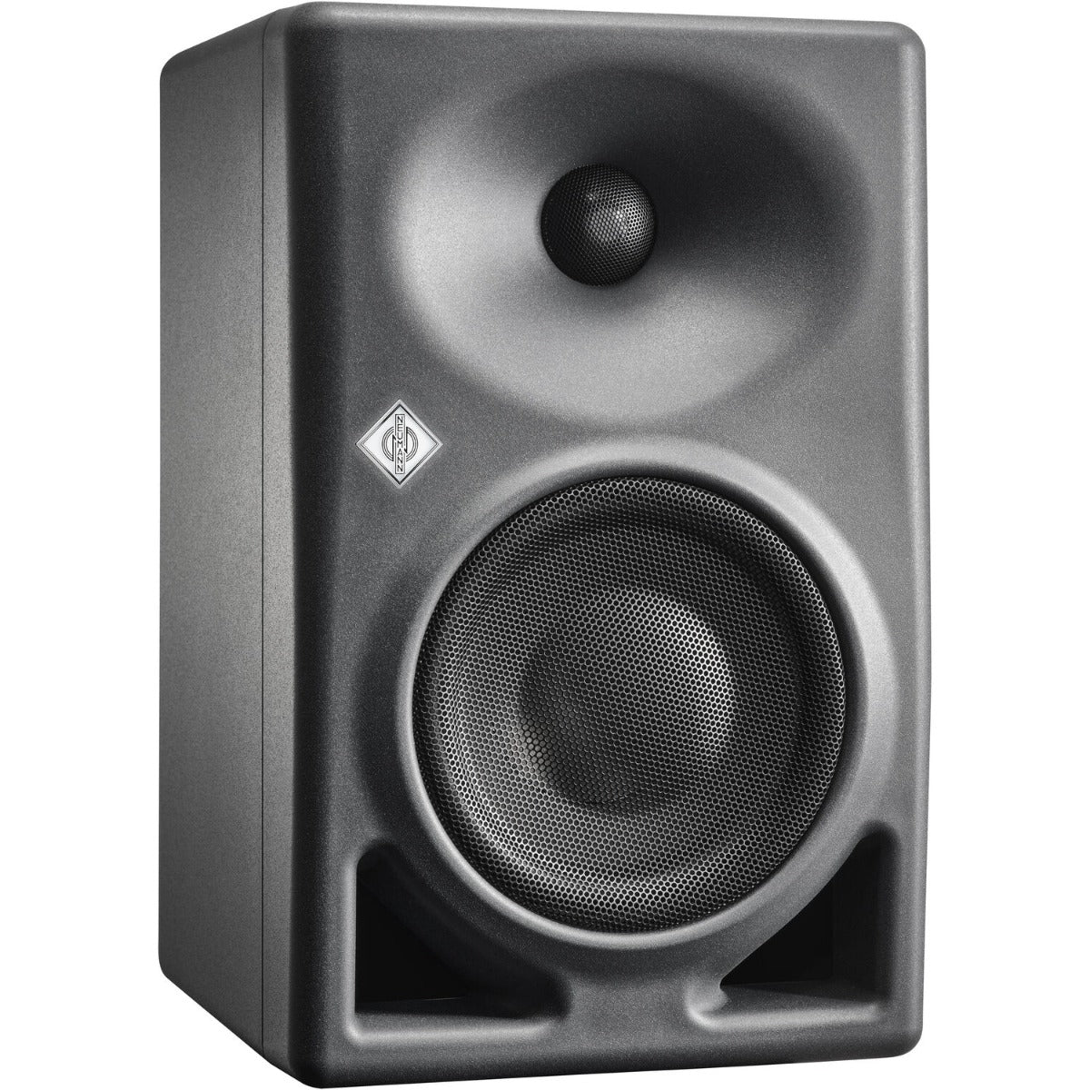 Neumann KH 120 II active nearfield studio monitors set on a desk with audio equipment in a professional recording studio.