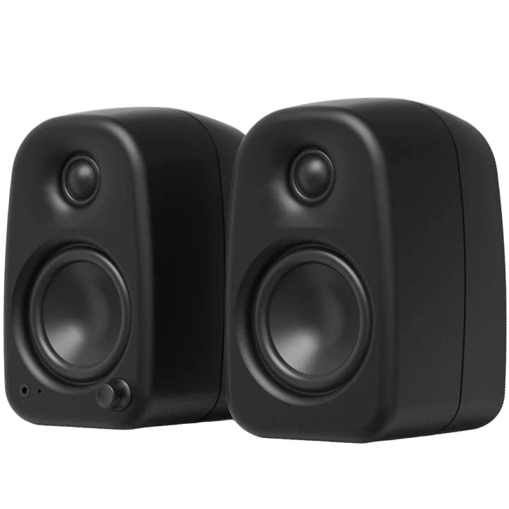 Kanto Audio UKI desktop speakers with 100W power, Bluetooth connectivity, black active bookshelf speakers on a desk.