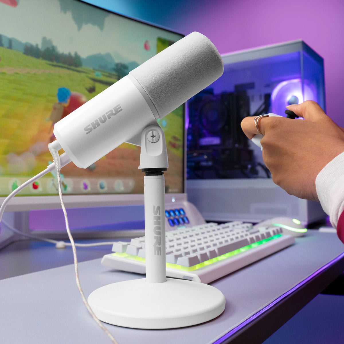 Shure MV6 Gen 2 White on a gaming desk in front of a PC and monitor
