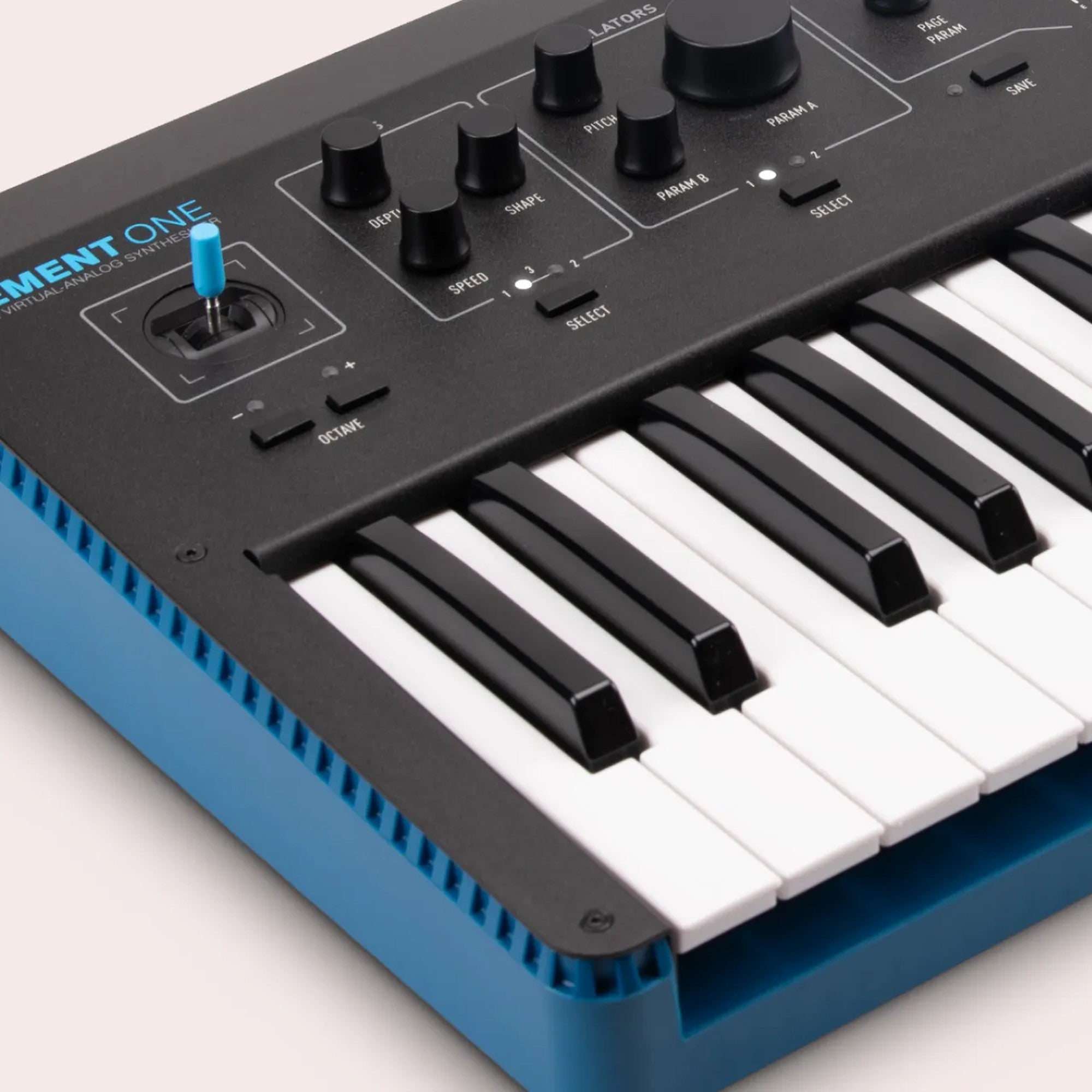Modal Electronics Element One keyboard synthesizer with a sleek black design and control knobs on a music studio setup.
