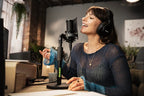 Shure SM4 condenser microphone with a sleek black body and metal grille, ideal for professional audio recording and broadcasting.
