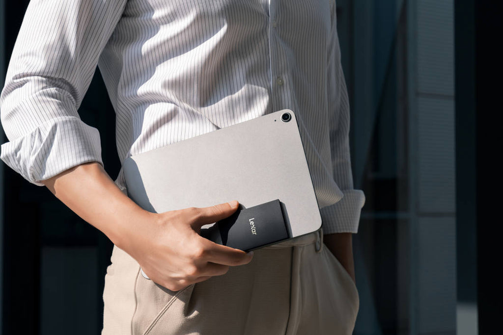 Lexar SL500 portable SSD external drive with sleek black design and USB-C interface, shown on a modern workspace.