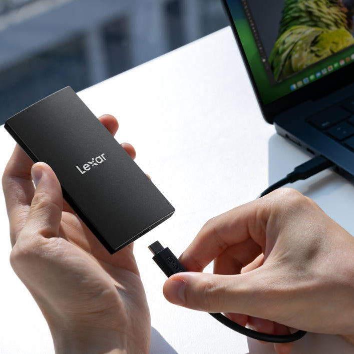 Lexar SL300 portable SSD external drive with sleek design and compact size for fast data storage and transfer.