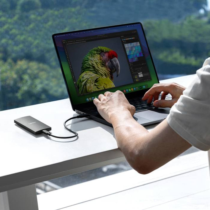 Lexar SL300 portable SSD external drive with sleek black design and compact size, ideal for fast data storage and transfer.