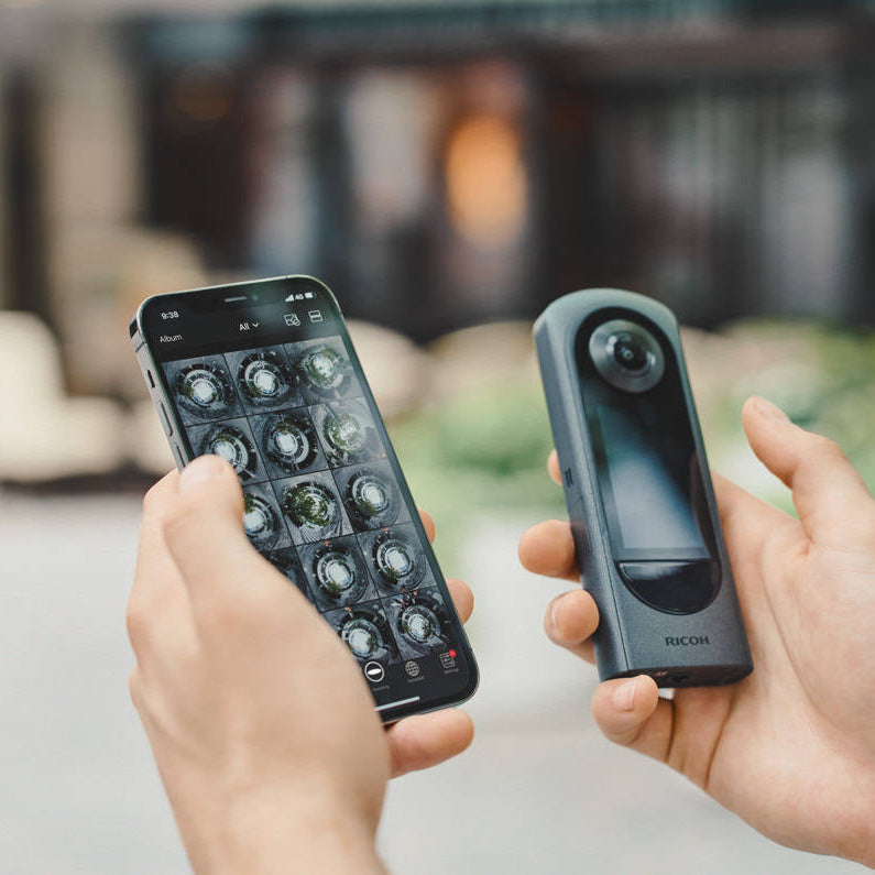 Ricoh Theta X 360-degree video camera with dual lenses and ergonomic design, ready for high-quality immersive video recording.