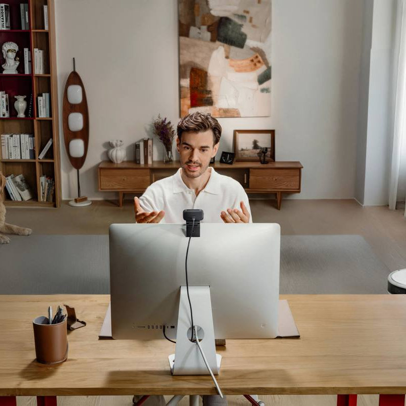 Insta360 Link 2C Pro video conferencing camera with adjustable lens and sleek black design, ideal for virtual meetings and streaming.