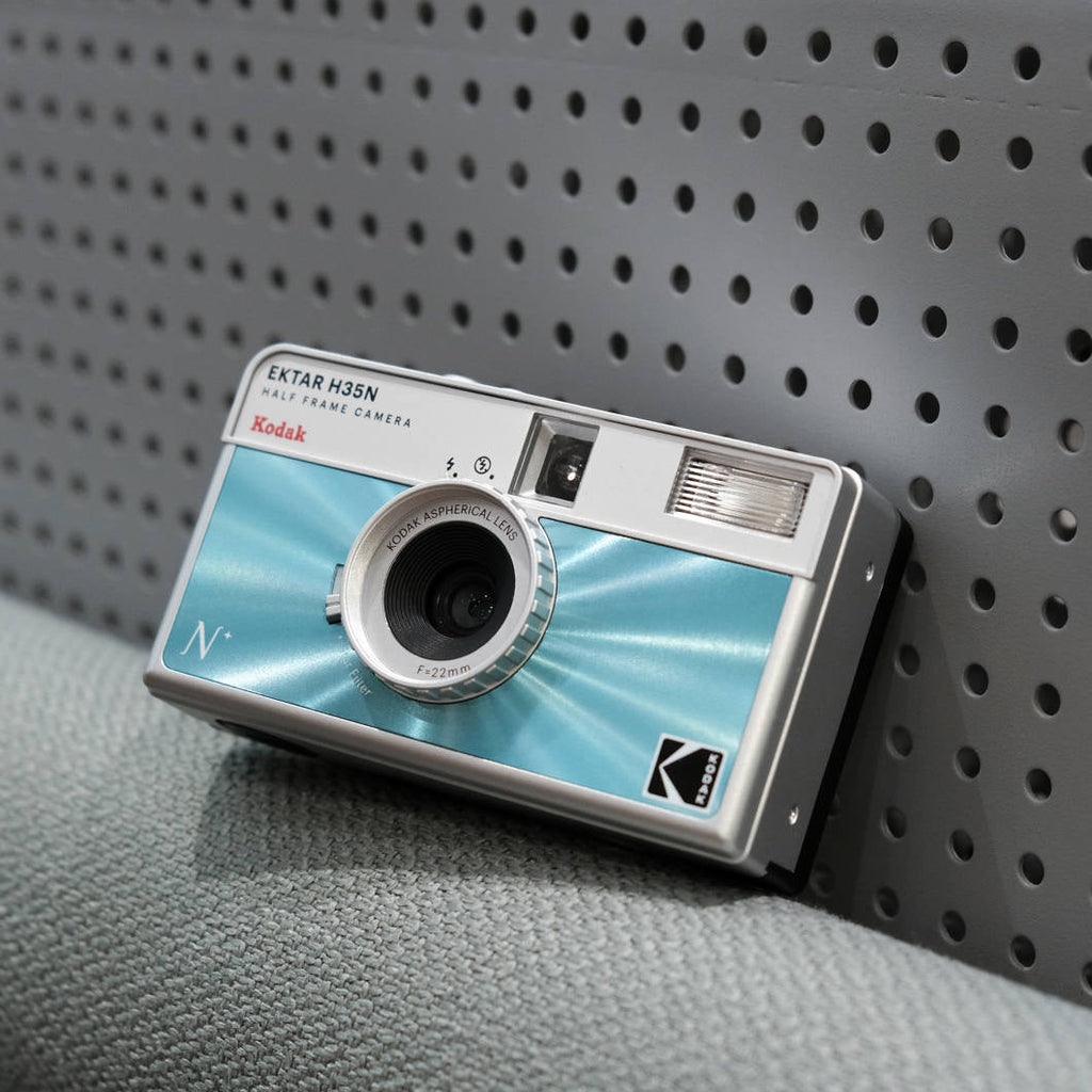 Kodak EKTAR H35N compact instant camera with red body and lens, designed for quick and easy instant photography.