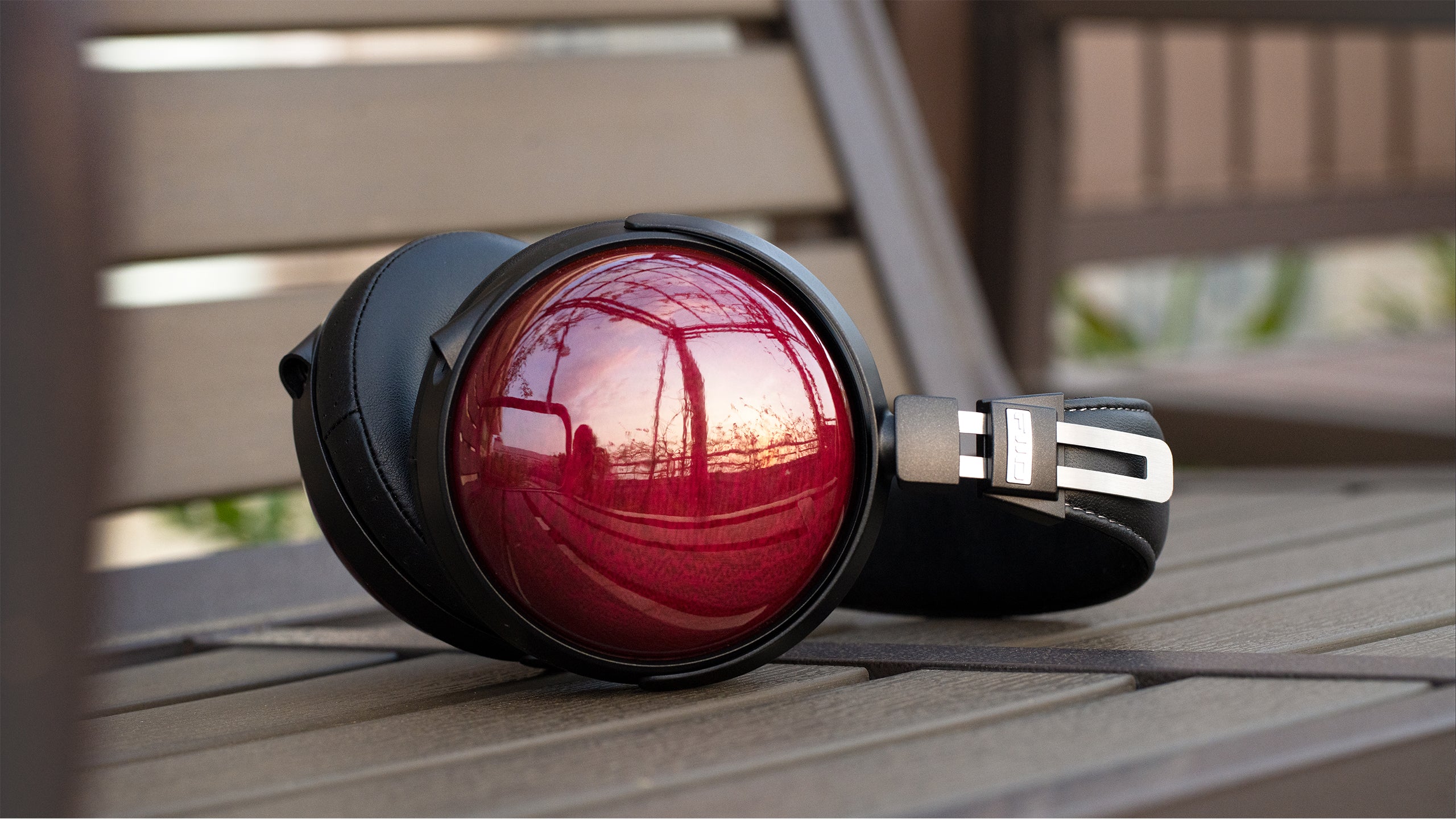 FiiO FT13 wired headphones with black ear cups and silver accents, featuring in-ear design and inline remote control.
