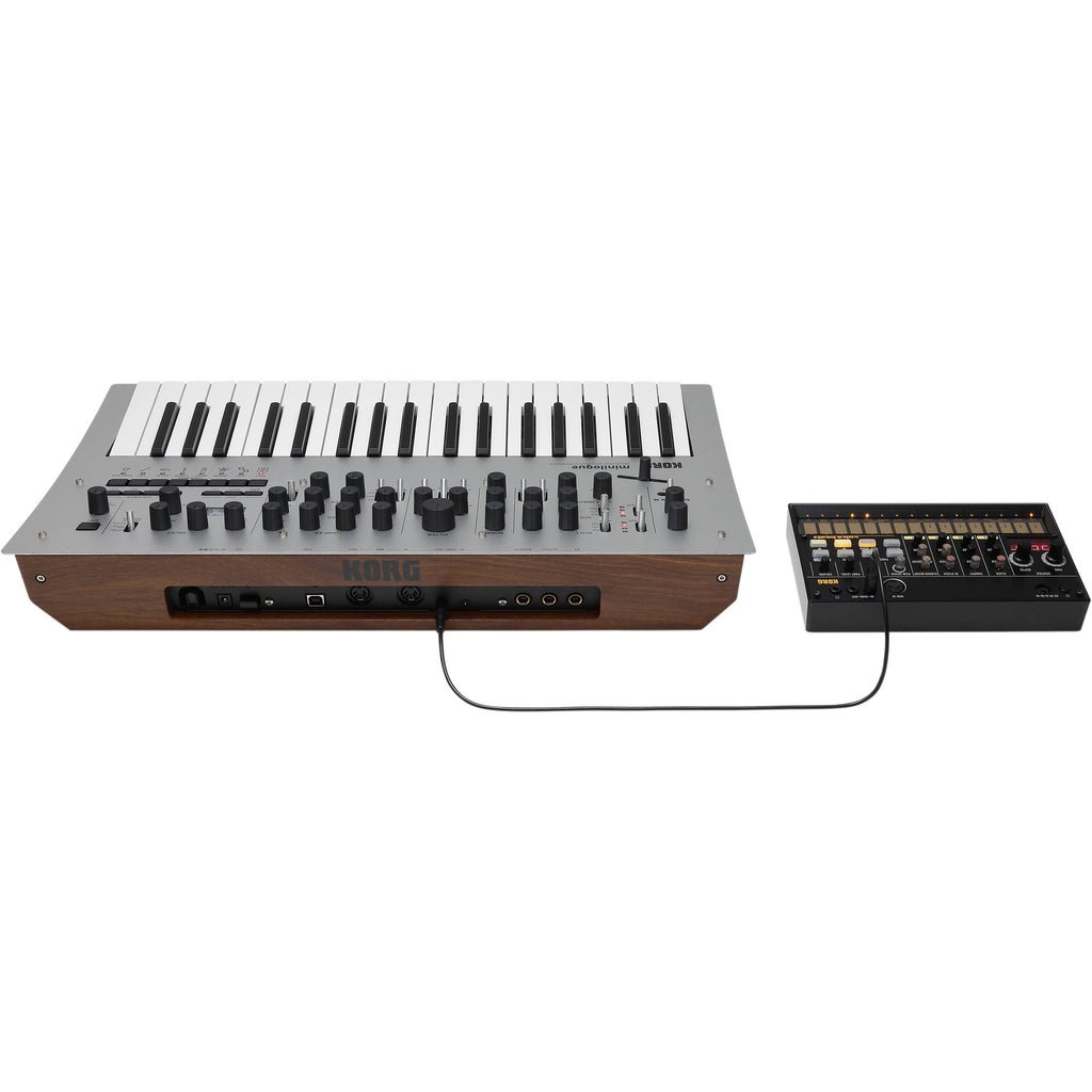 Korg Minilogue synthesizer with knobs and keys, compact musical instrument for creating electronic sounds and melodies.
