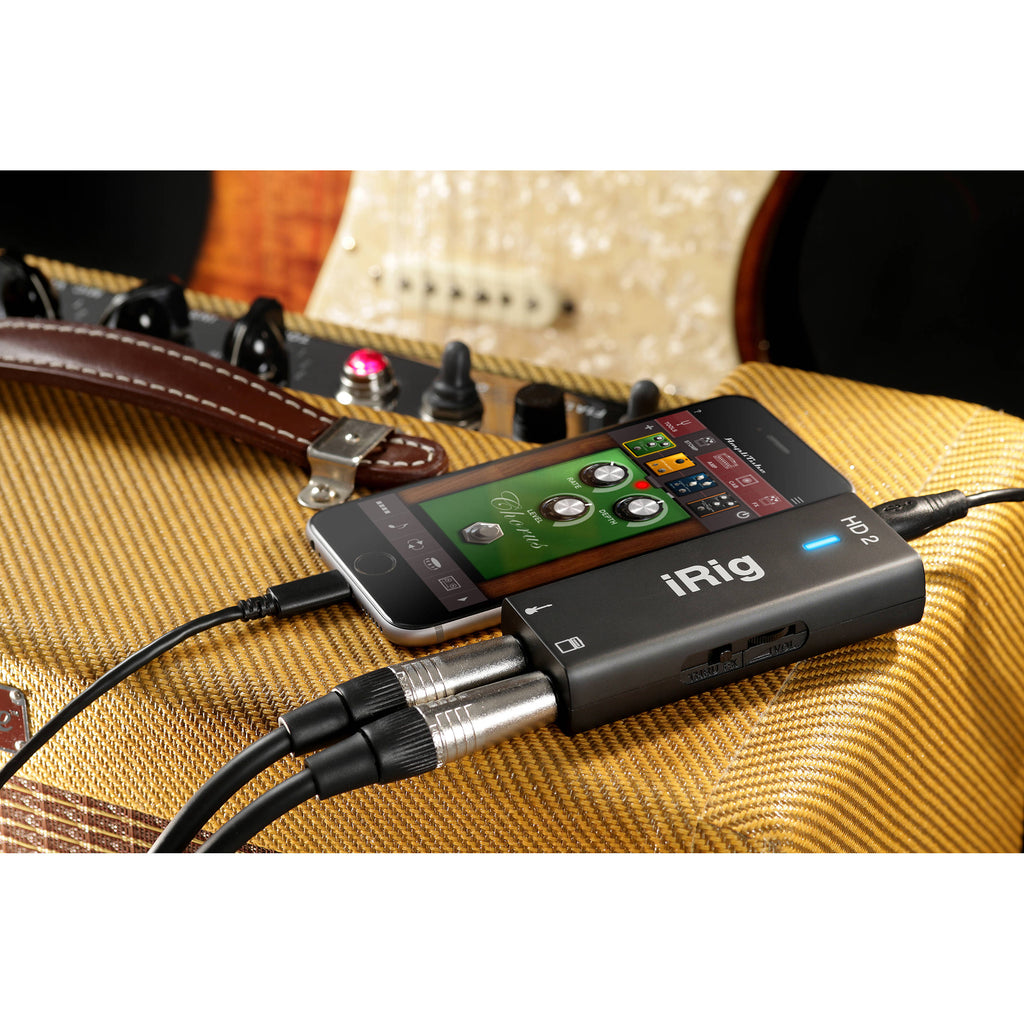 IK Multimedia iRig HD 2 guitar/bass audio interface with input and output jacks, compact design for mobile recording.