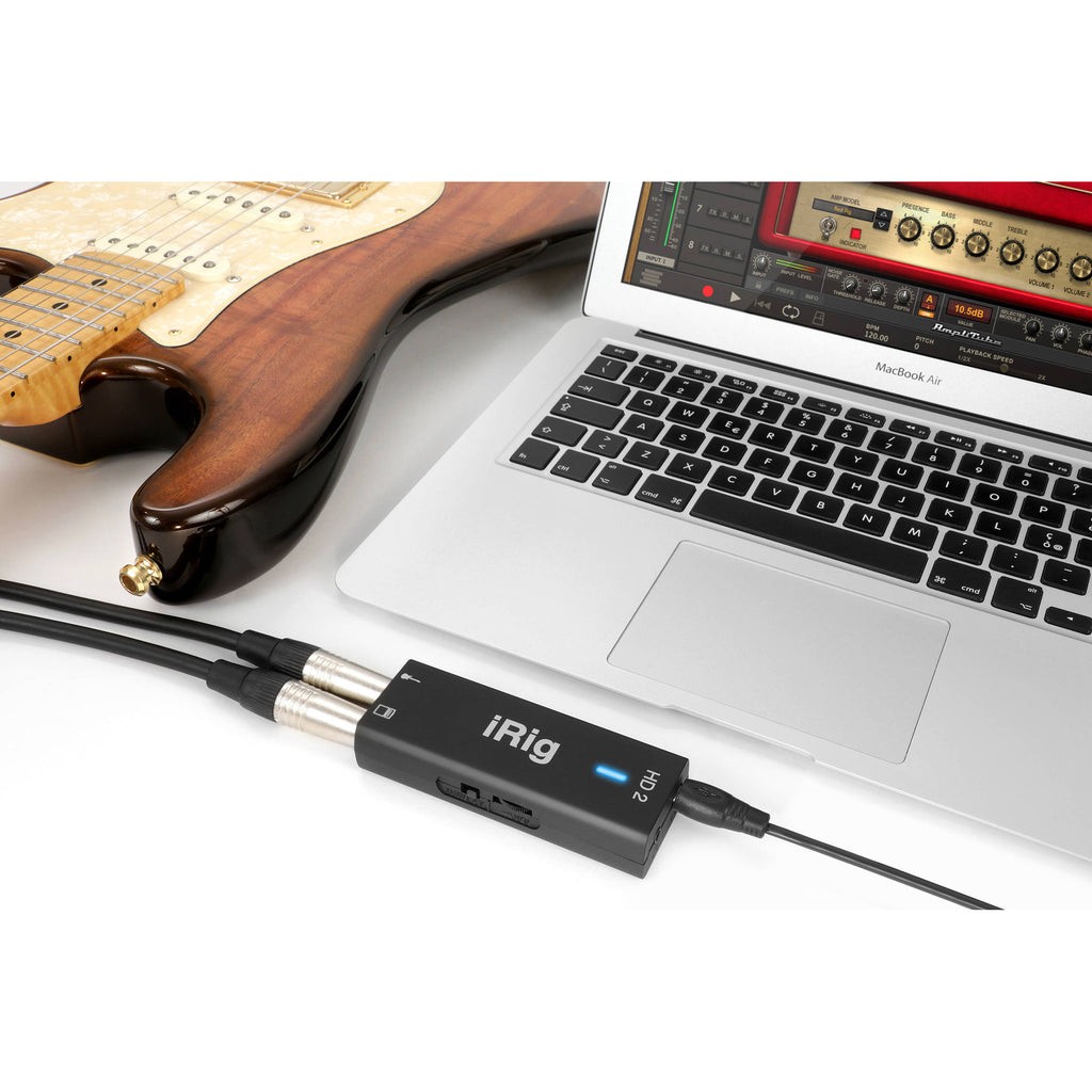 IK Multimedia iRig HD 2 audio interface with USB cable and connecting ports for guitar or instrument recording.