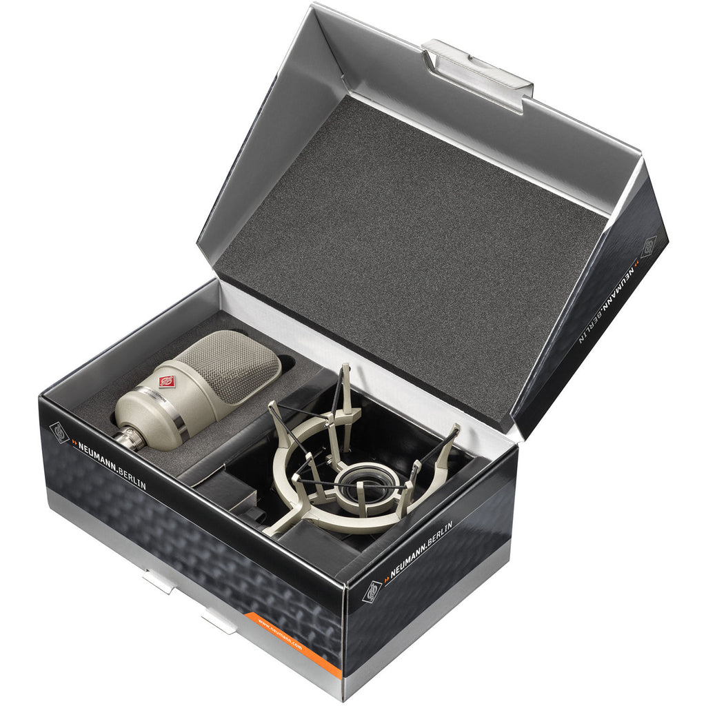 Neumann TLM 107 condenser microphone studio set with microphone and accessories on a professional recording setup.