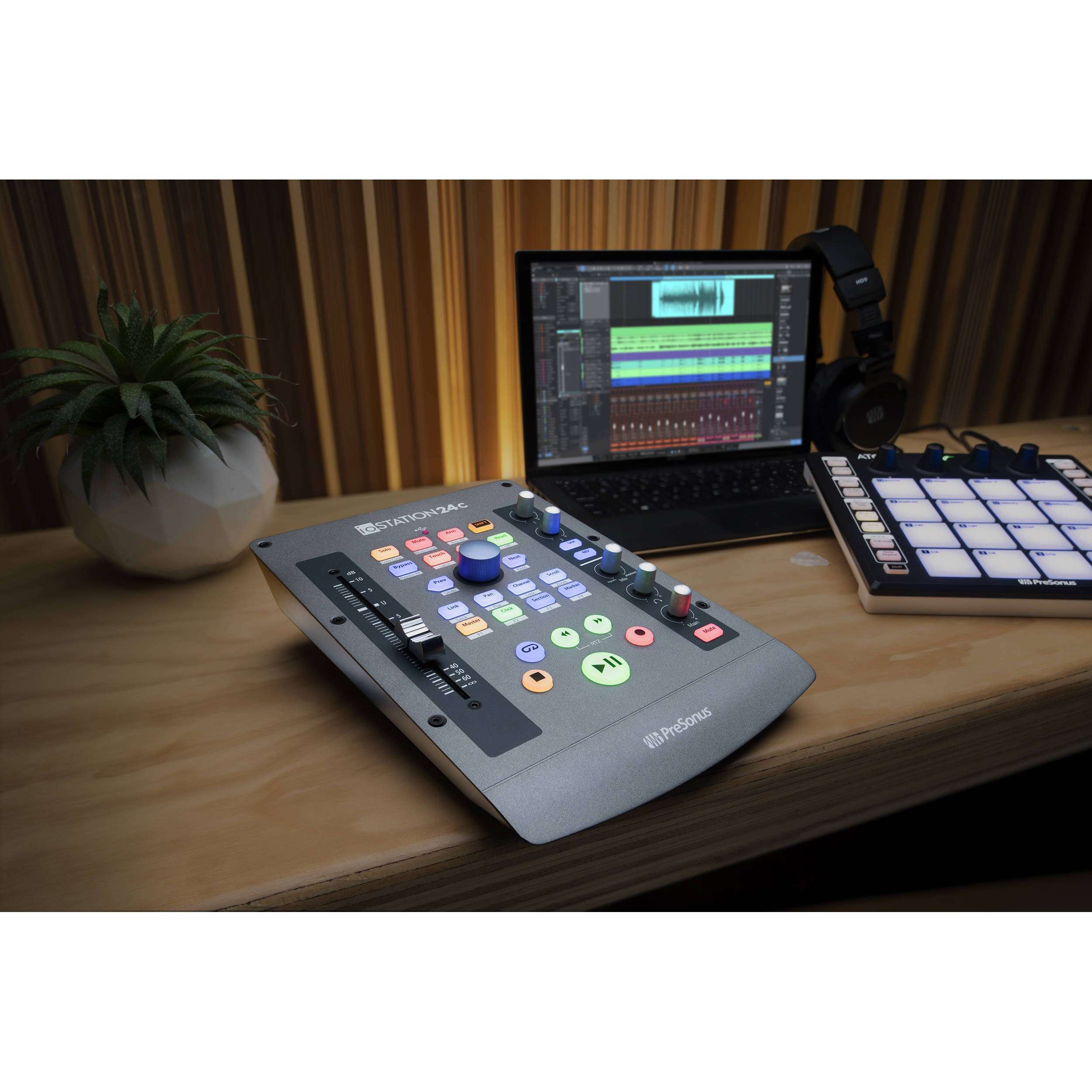 Presonus iOStation 24c DAW controller with multiple knobs, faders, and interface ports for music production and audio editing.