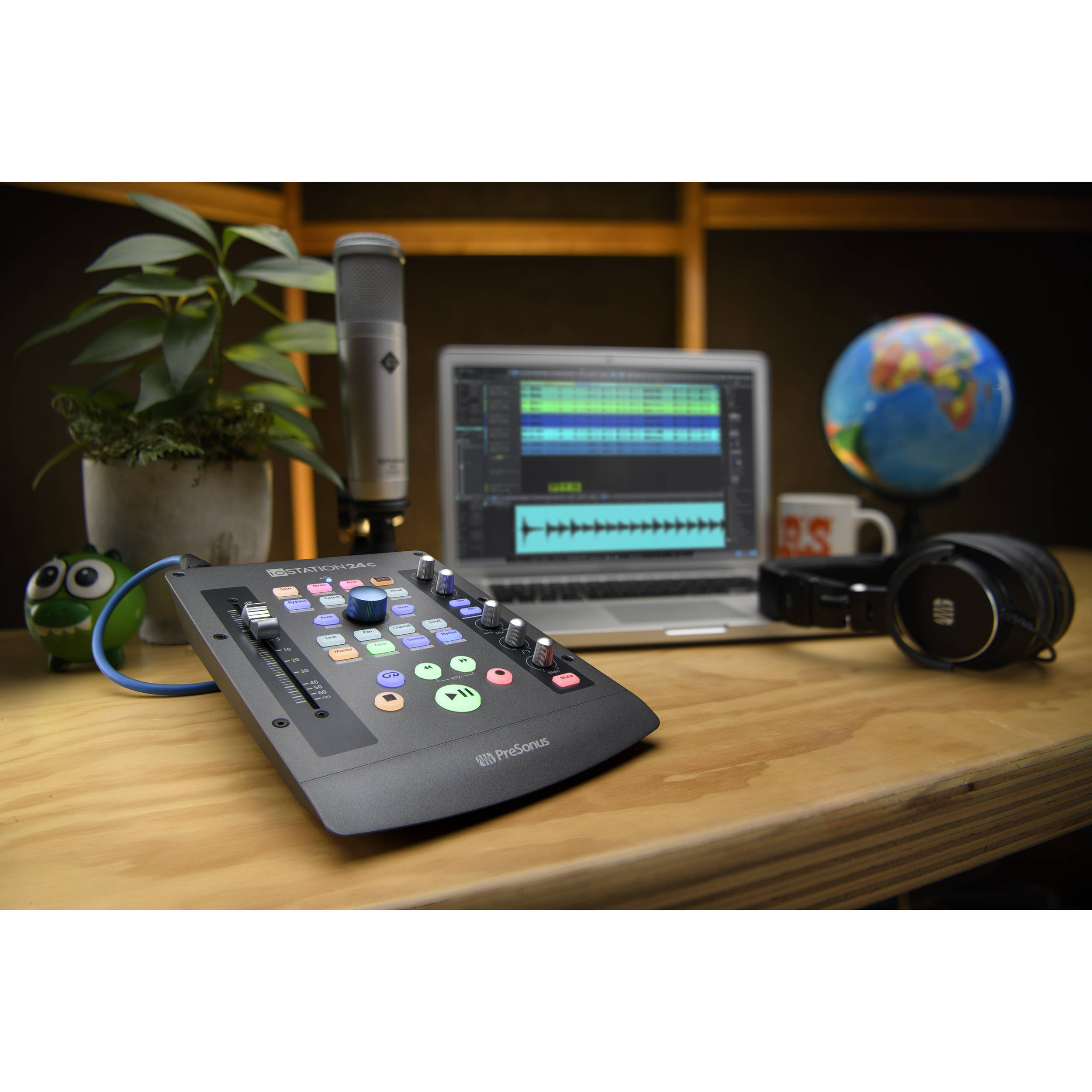 Presonus iOStation 24c DAW controller with audio interface, featuring multiple knobs and input ports for music production.