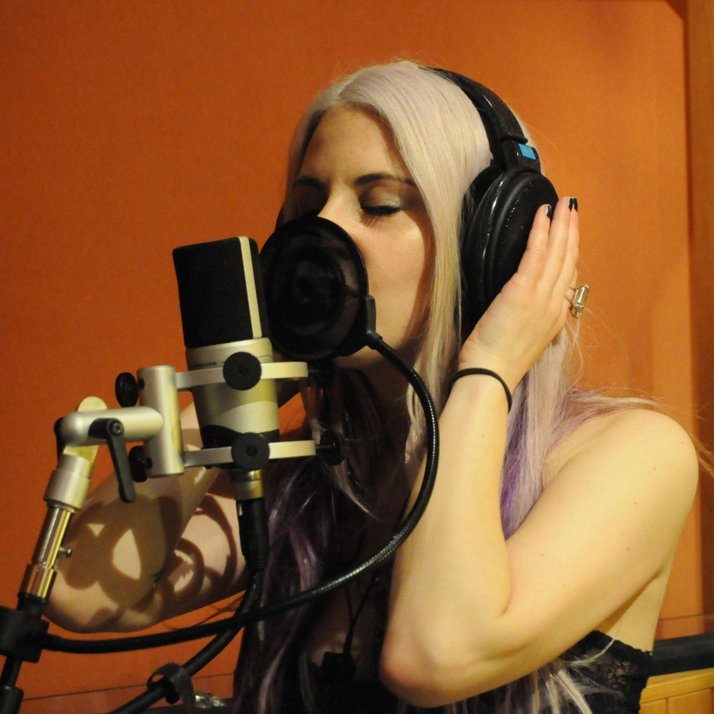 Sennheiser HD 600 studio headphones with open-back design, featuring over-ear cushions and silver accents.