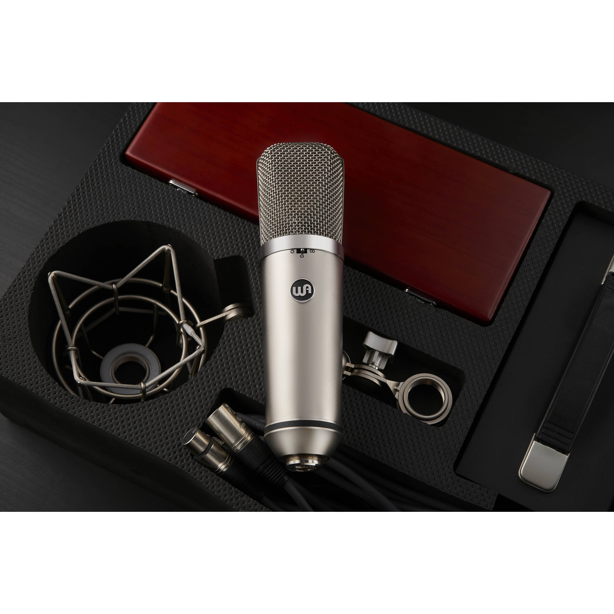 Warm Audio WA-67 condenser microphone with vintage-style design and large diaphragm for studio recording and vocals.