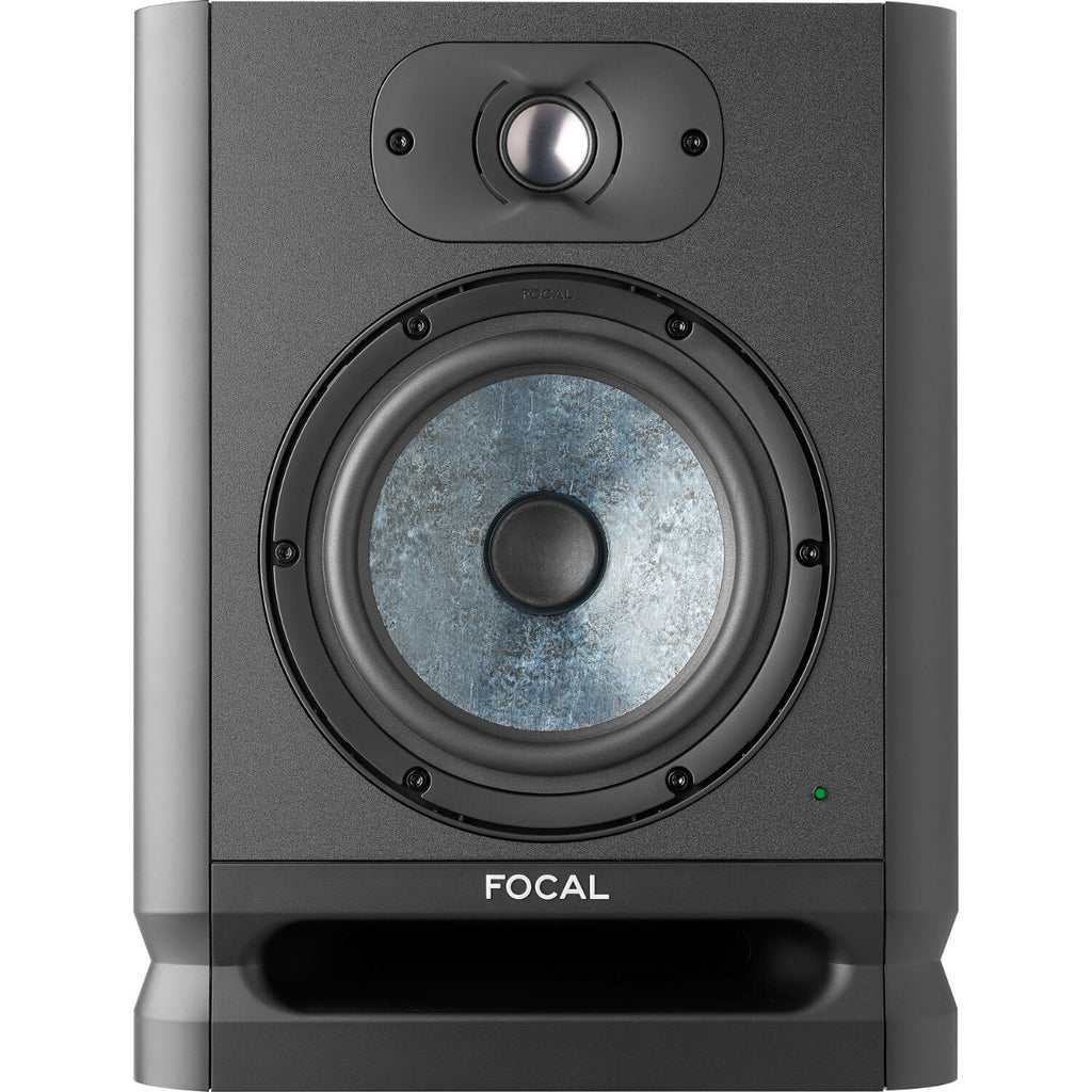 Focal Alpha 65 Evo active nearfield monitors, two black studio speakers with control knobs and ports, on a wooden surface.