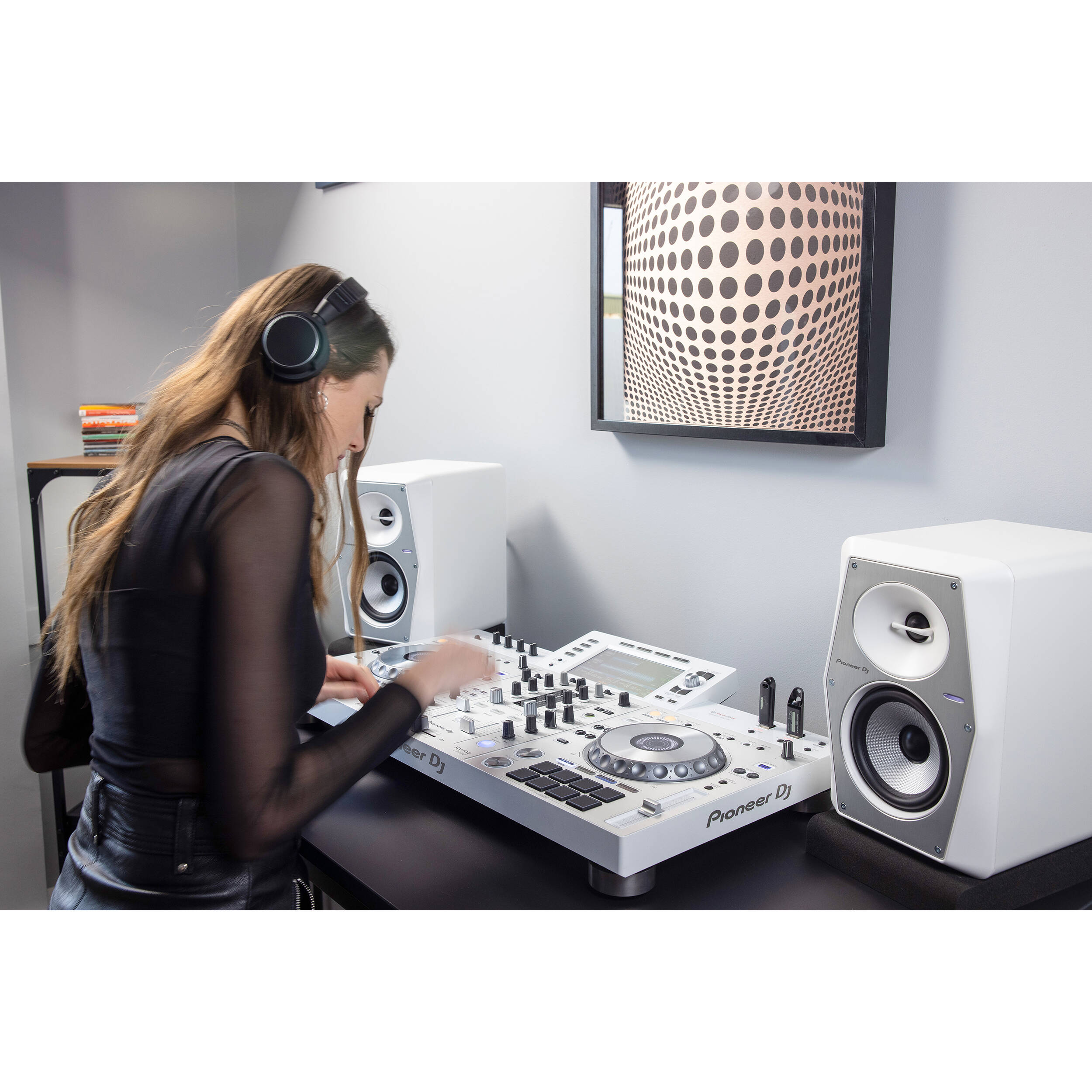 Pioneer DJ VM-50 active nearfield monitors with black speaker cabinets and front-facing controls, ideal for studio audio setups.