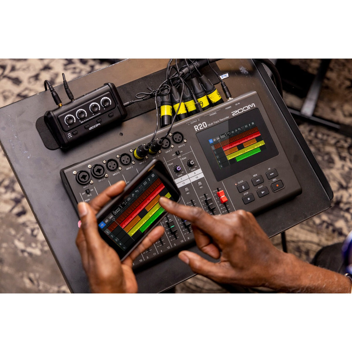 Zoom R20 digital recorder with multiple track buttons and a sleek display for easy audio recording and playback.