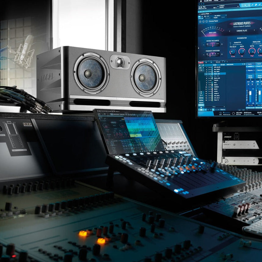 Focal Alpha Twin Evo mid-field and main studio monitors, showing sleek black speakers with control knobs and branding.