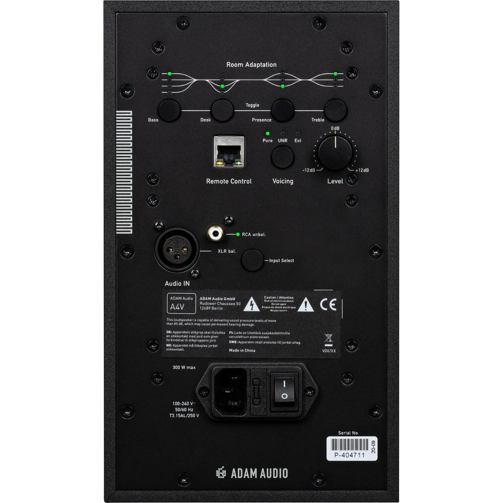 Adam Audio A4V active nearfield monitors on a desk, showing their sleek black design and front grille with branding.