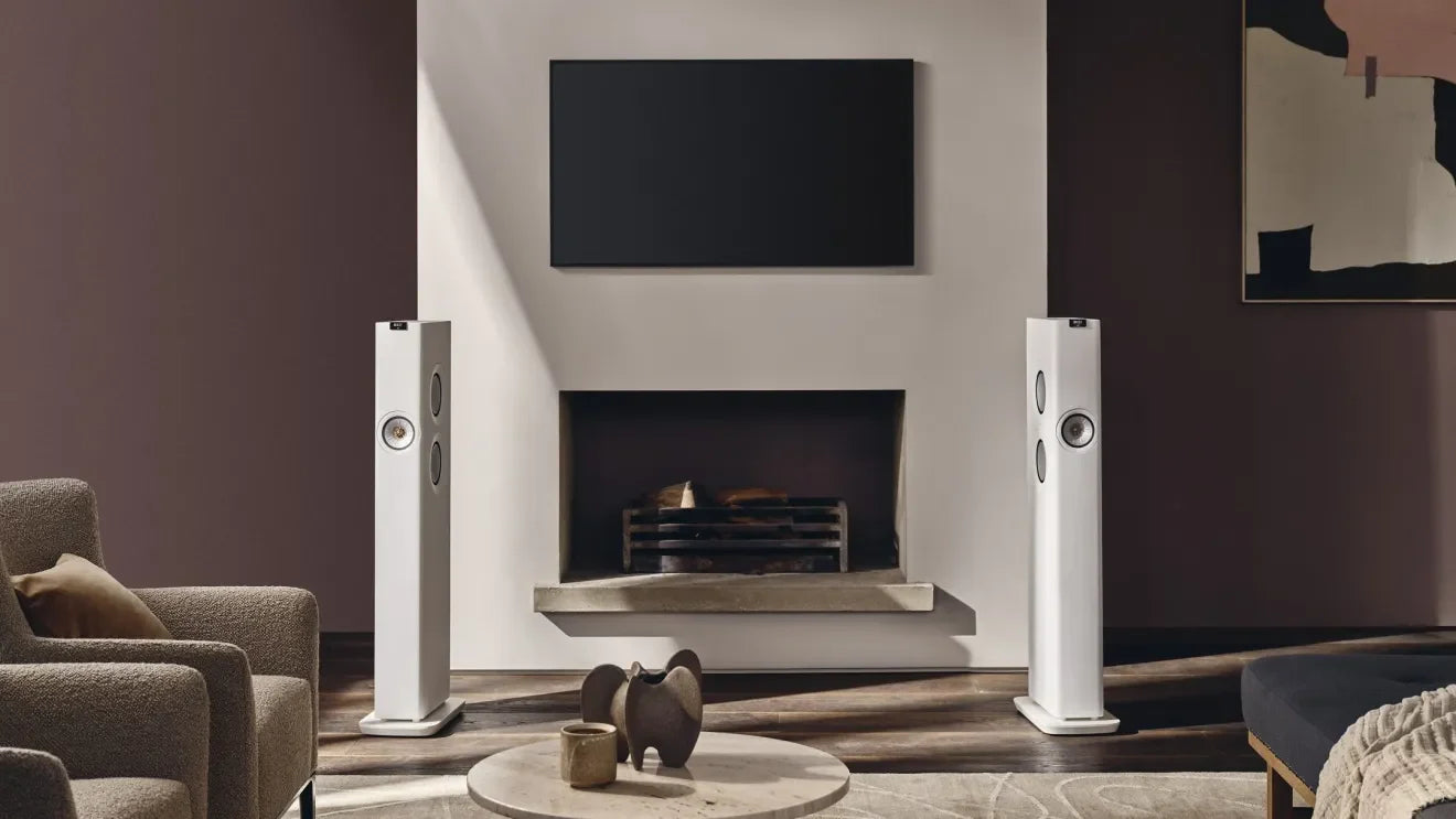 KEF LS60 Wireless floorstanding speakers with sleek black cabinets and modern design for high-quality audio.