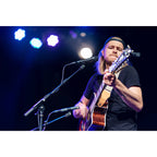Austrian Audio CC8 condenser microphone with black body and grille, shown on a stand with cable, ideal for studio recording.