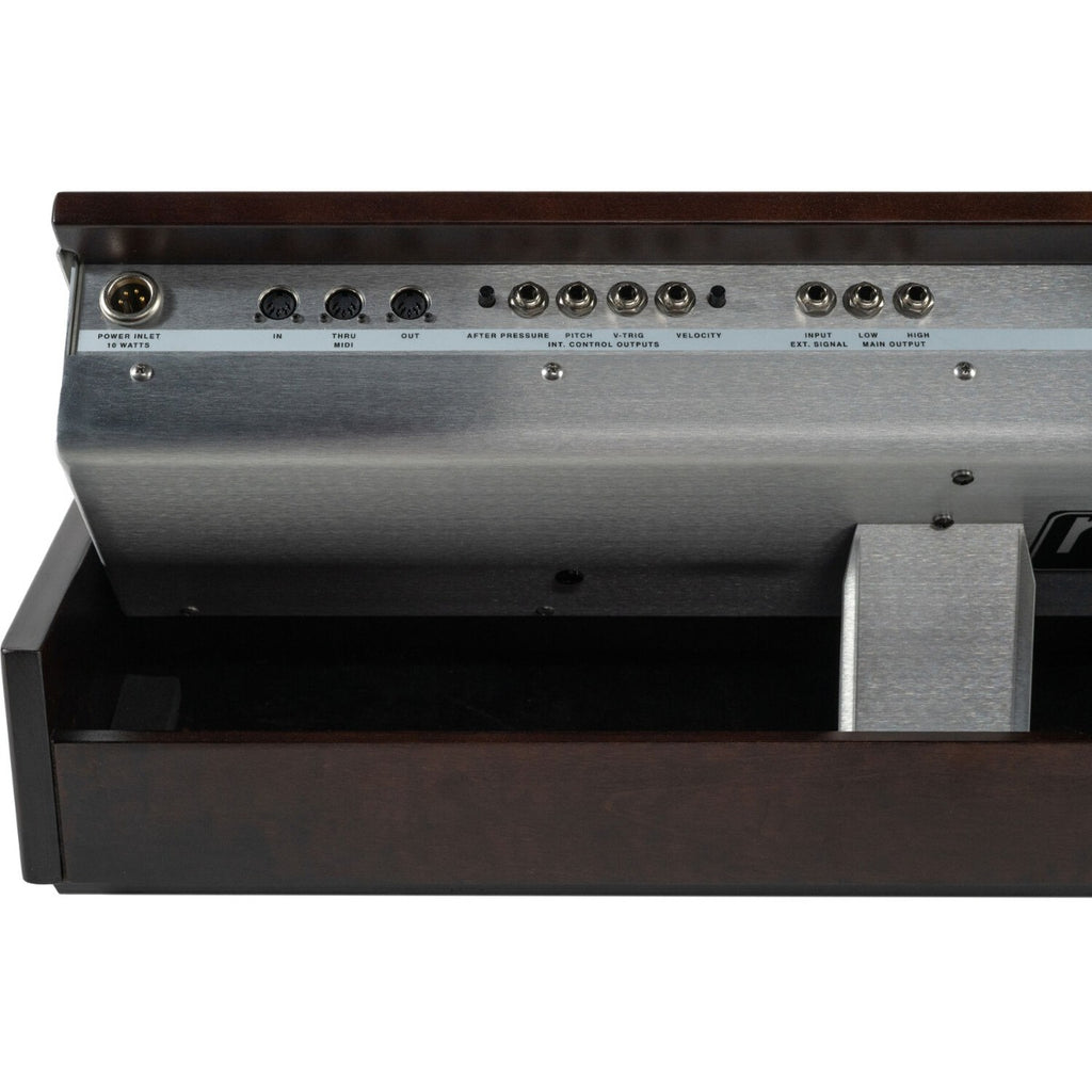 Moog Minimoog Model D synthesizer with classic control knobs and keyboard, vintage analog music instrument.