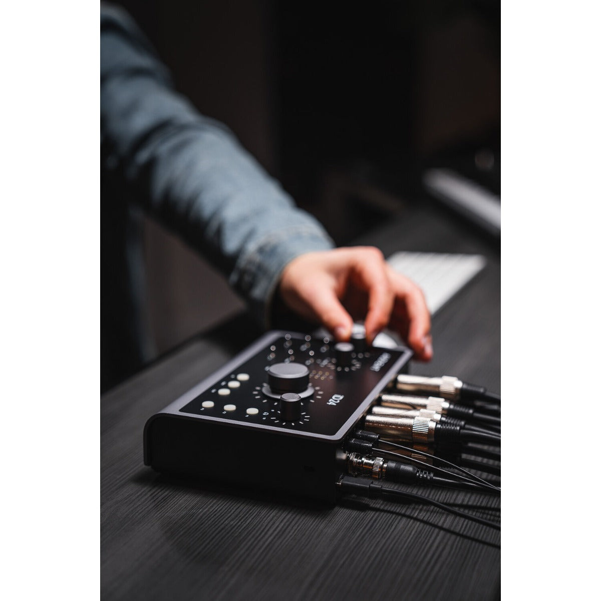 Audient iD24 audio interface with multiple input/output ports and control knobs, designed for professional music recording and production.