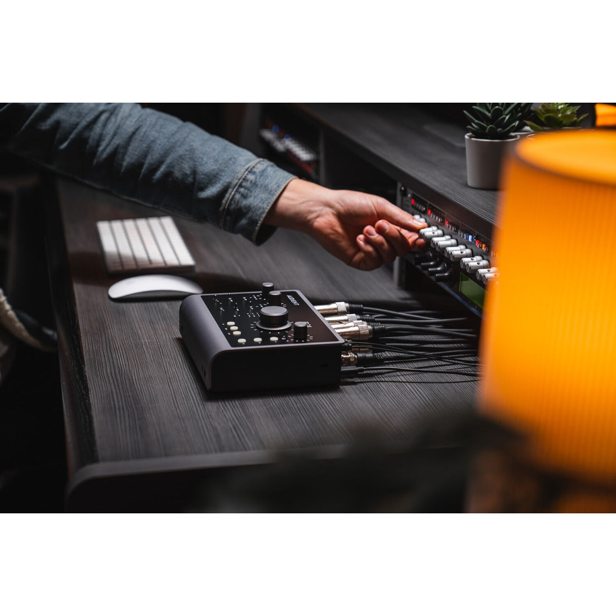 Audient iD24 audio interface showing front panel with input/output controls and digital display for high-quality audio recording.