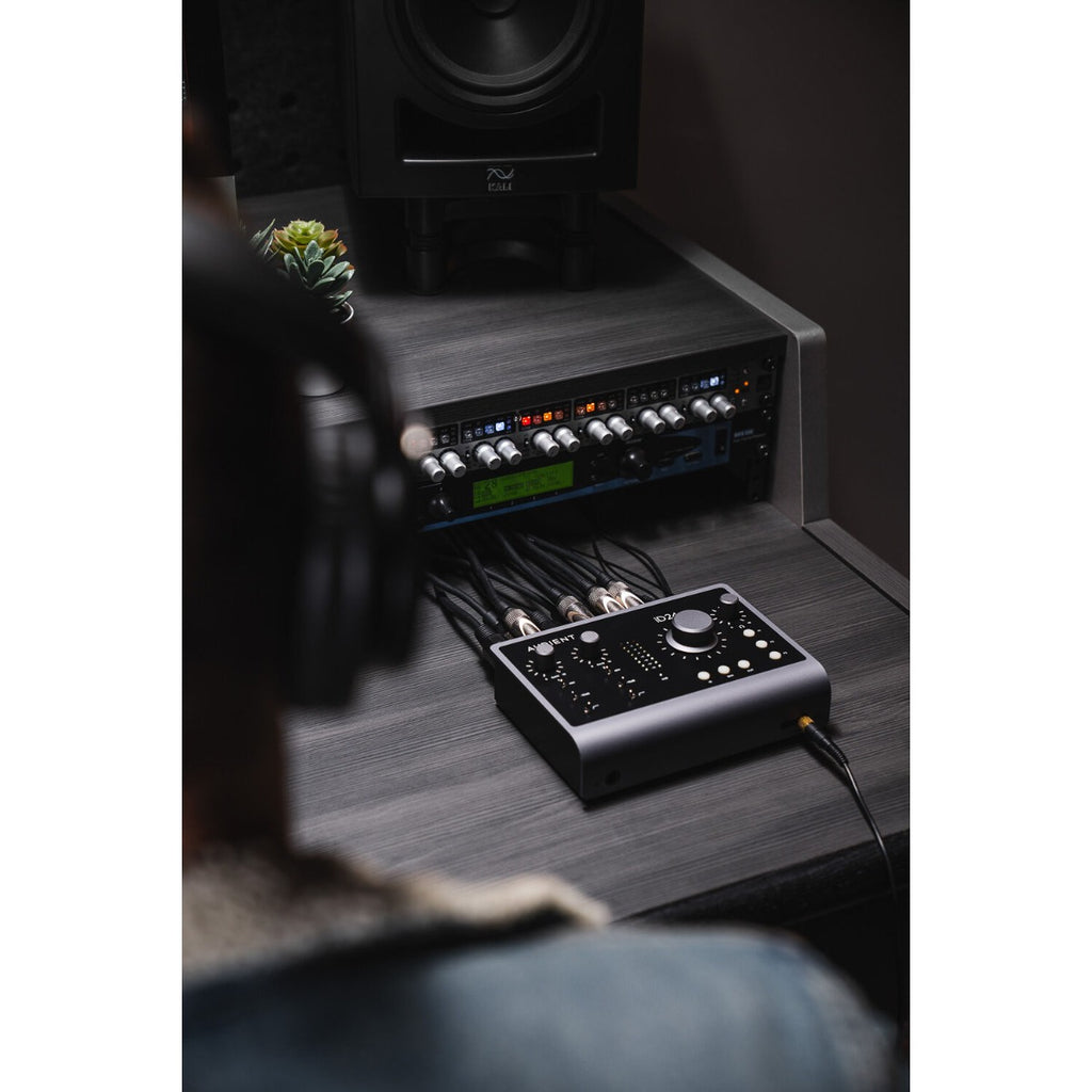 Audient iD24 audio interface with multiple input/output ports and control knobs, designed for music production and recording.