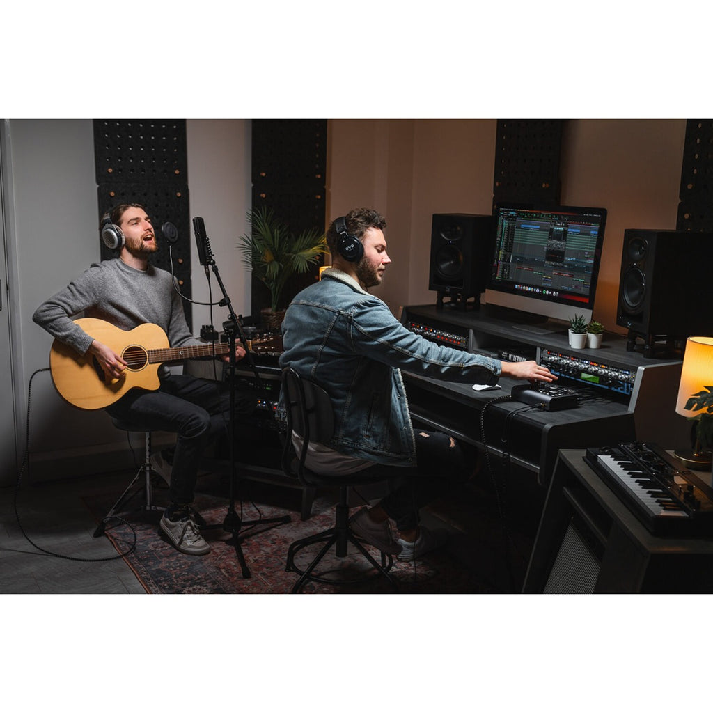 Audient iD24 audio interface with input and output ports, control knobs, and sleek black design for professional sound recording.