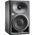 Neumann KH 120 II active nearfield studio monitors set on a desk with audio equipment in a professional recording studio.