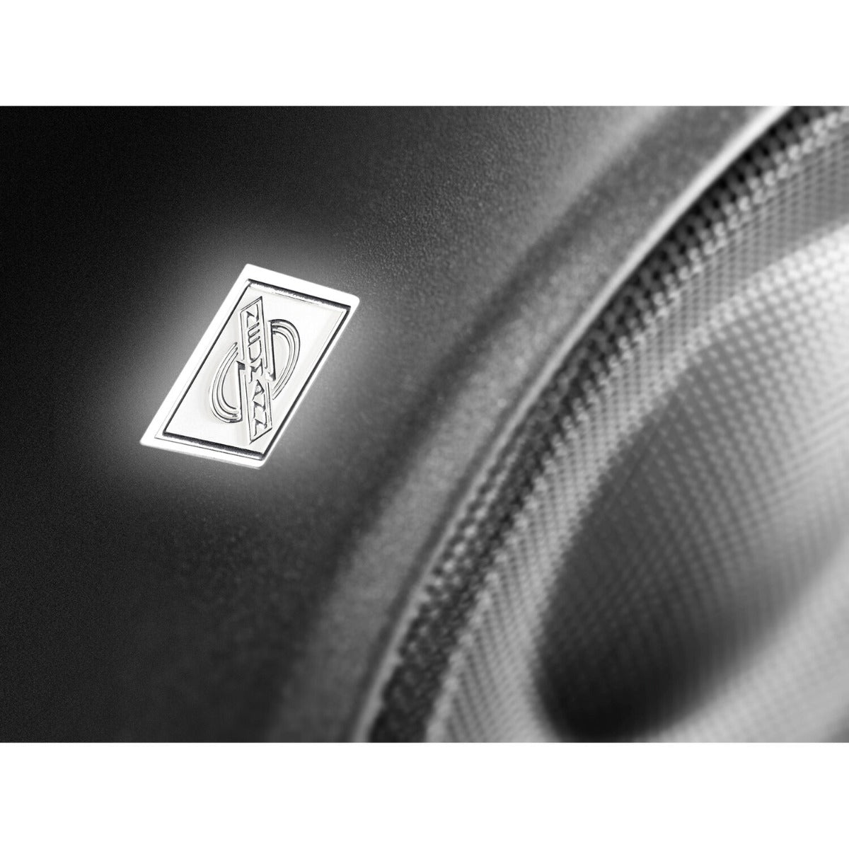 Neumann KH 120 II active nearfield monitor speaker with sleek black enclosure and detailed sound components visible.