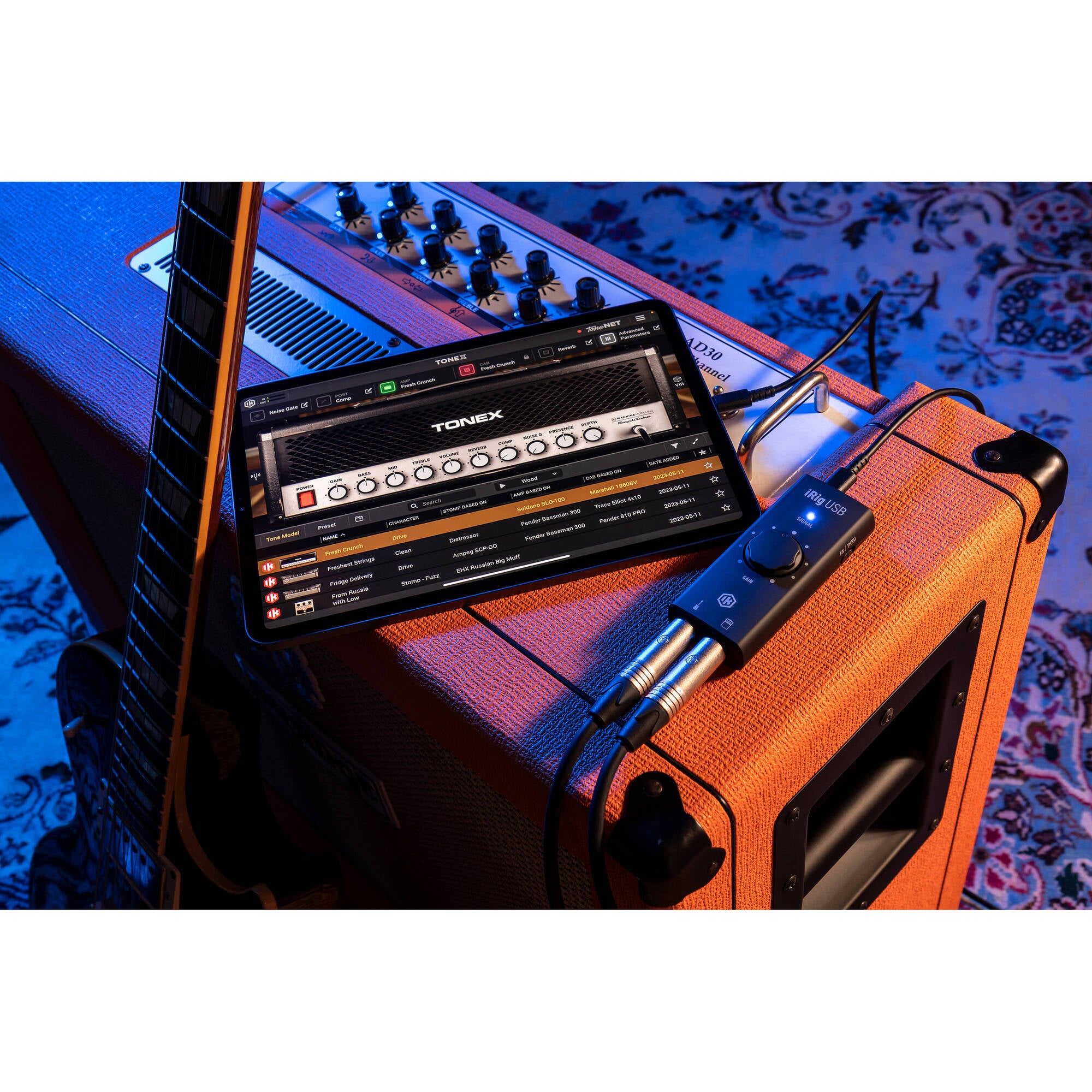 IK Multimedia iRig USB audio interface with input and output jacks, compact design for mobile music recording and audio processing.