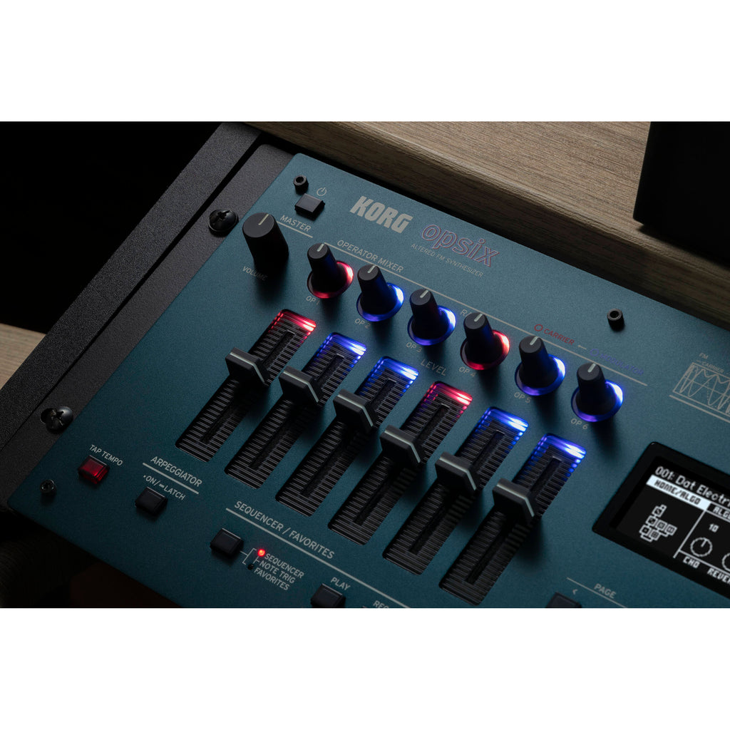 Korg Opsix synthesizer module with colorful control knobs and keyboard interface, showcasing compact electronic music equipment.