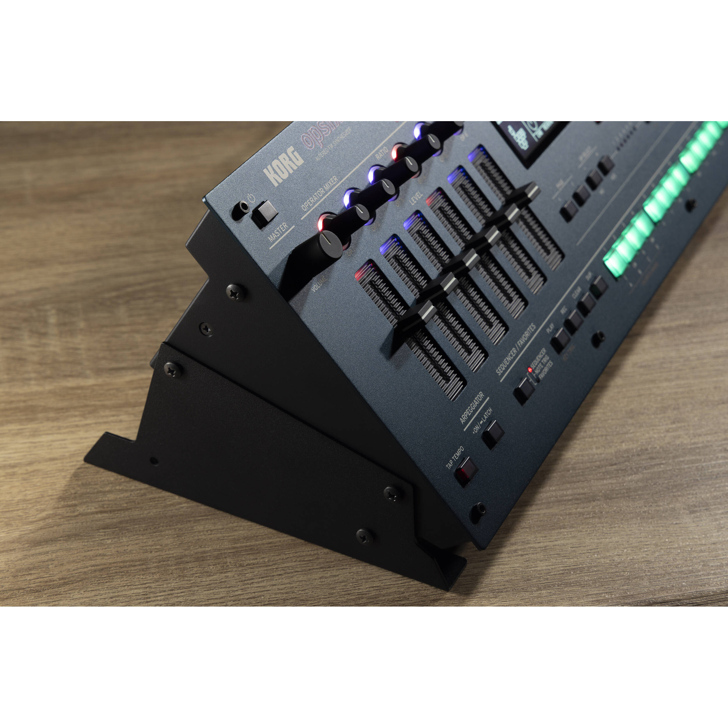 Korg Opsix synthesizer module with colorful control knobs and buttons, compact electronic music instrument for sound design.