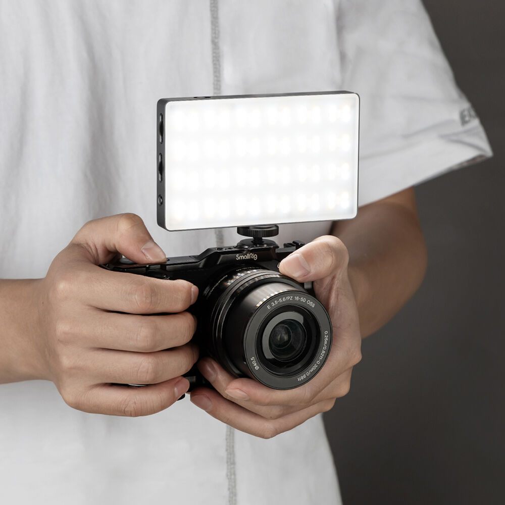 SmallRig RM120 RGB video light showing adjustable color settings and compact design for professional lighting.