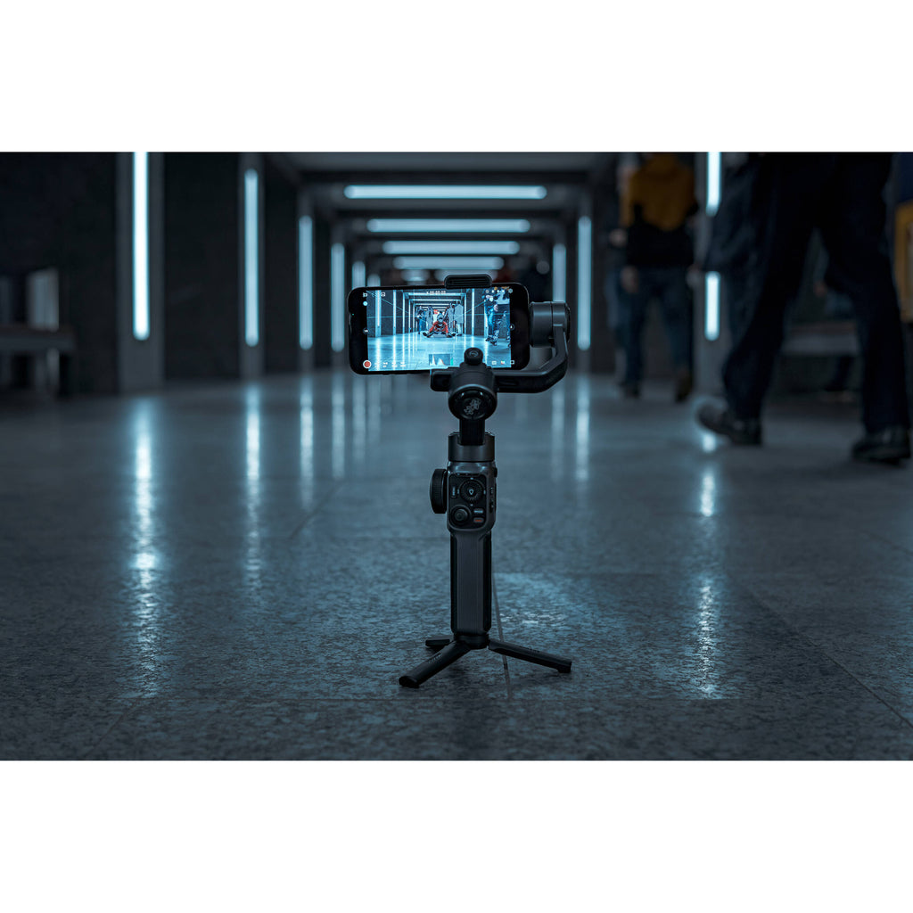Zhiyun Smooth 5S handheld stabilizer and gimbal for smartphone photography, with ergonomic grip and control buttons.