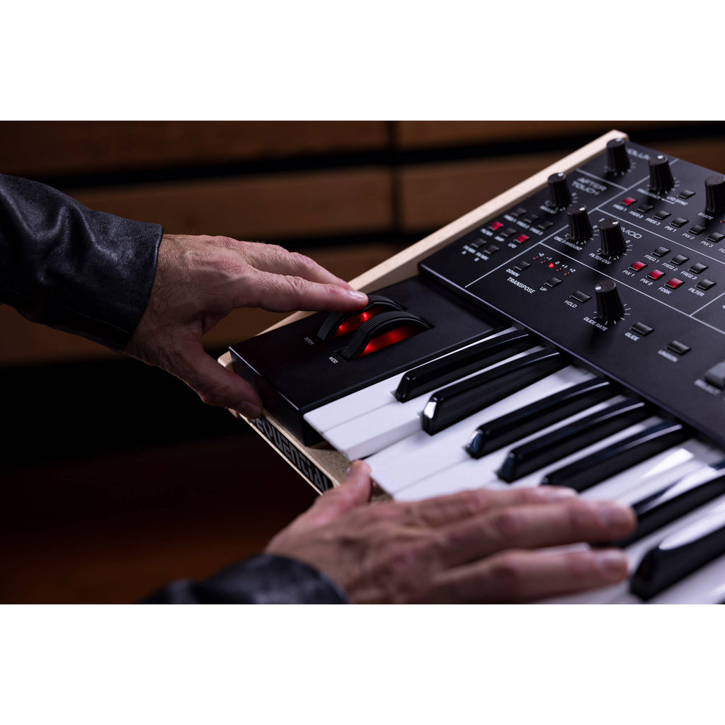 Sequential Trigon-6 synthesizer with multiple knobs and patch points, showcasing its compact, modern design.