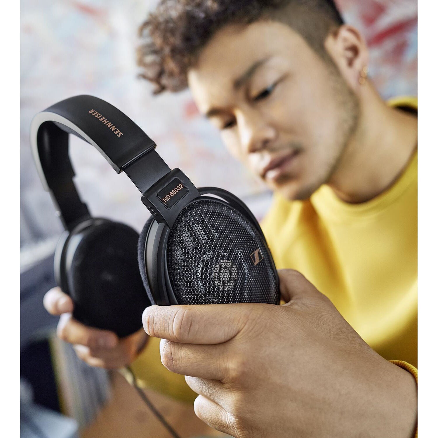 Sennheiser HD 660S2 open-back headphones with black earcups and adjustable headband, designed for high-fidelity audio listening.