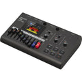 Zoom R12 digital recorder with multiple input ports and a large display screen, ideal for professional audio recording.