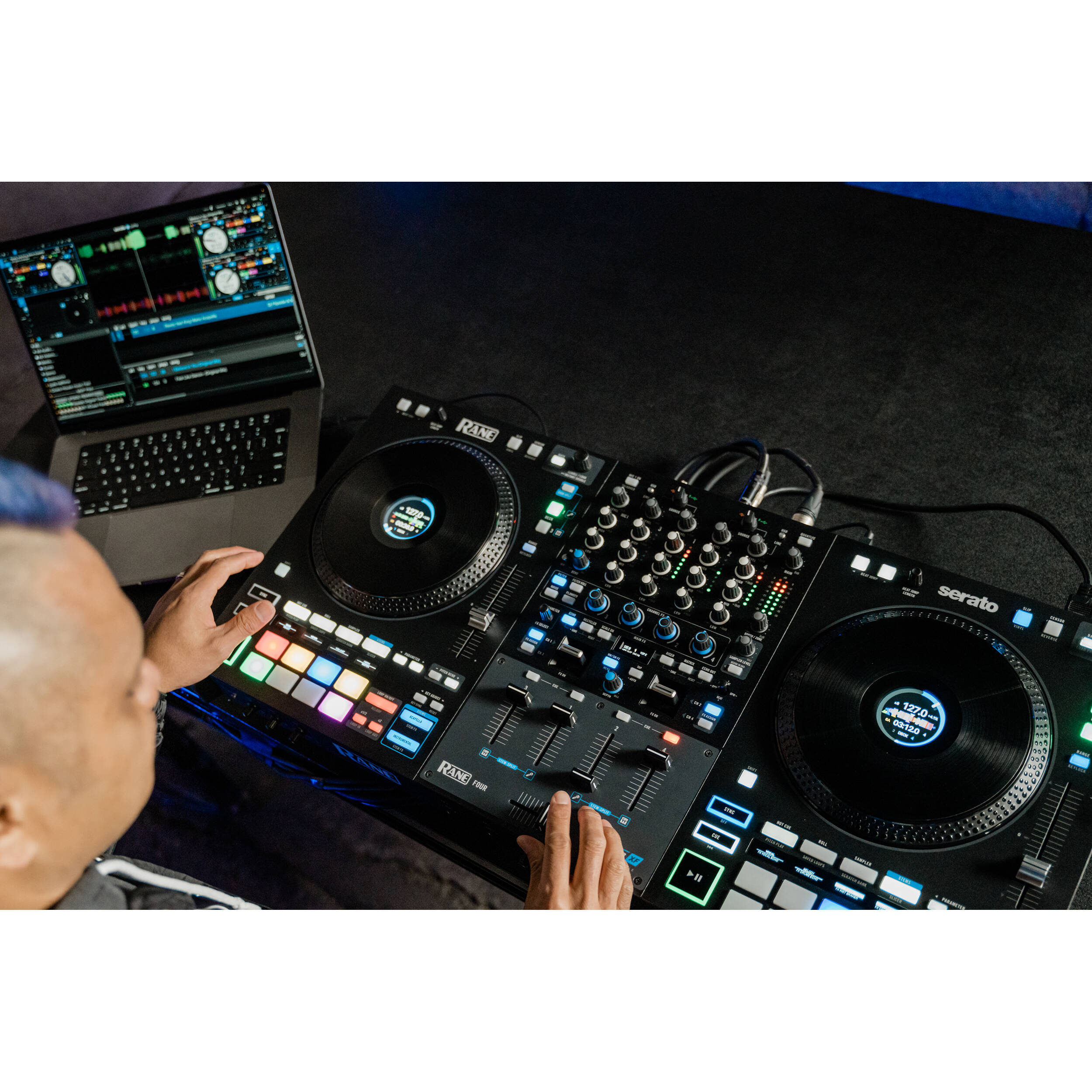 Rane Four DJ controller with jog wheels, mixer controls, and performance pads, designed for professional DJ setups.