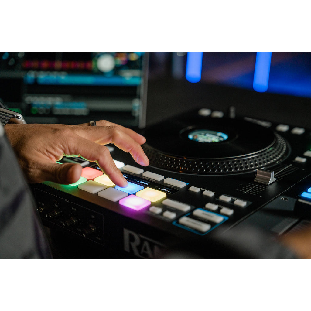 Rane Four DJ controller with dual jog wheels, mixer controls, and colorful pads for professional DJ mixing and performance.