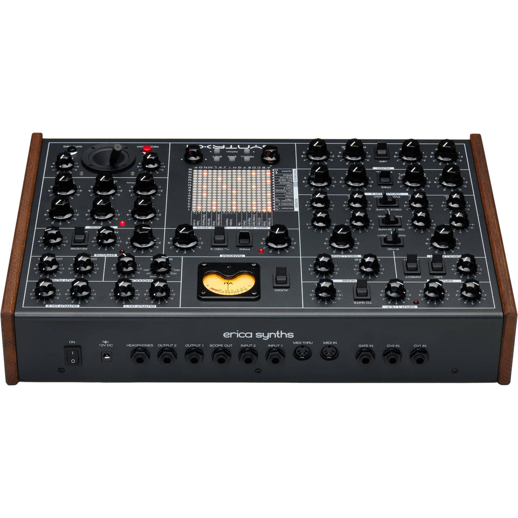 Erica Synths SYNTRX II desktop synthesizer with knobs, buttons, and patch points on a black module with colorful accents.