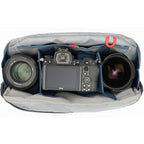 Think Tank PressPass video equipment bag with padded compartments and adjustable straps for professional camera gear storage.