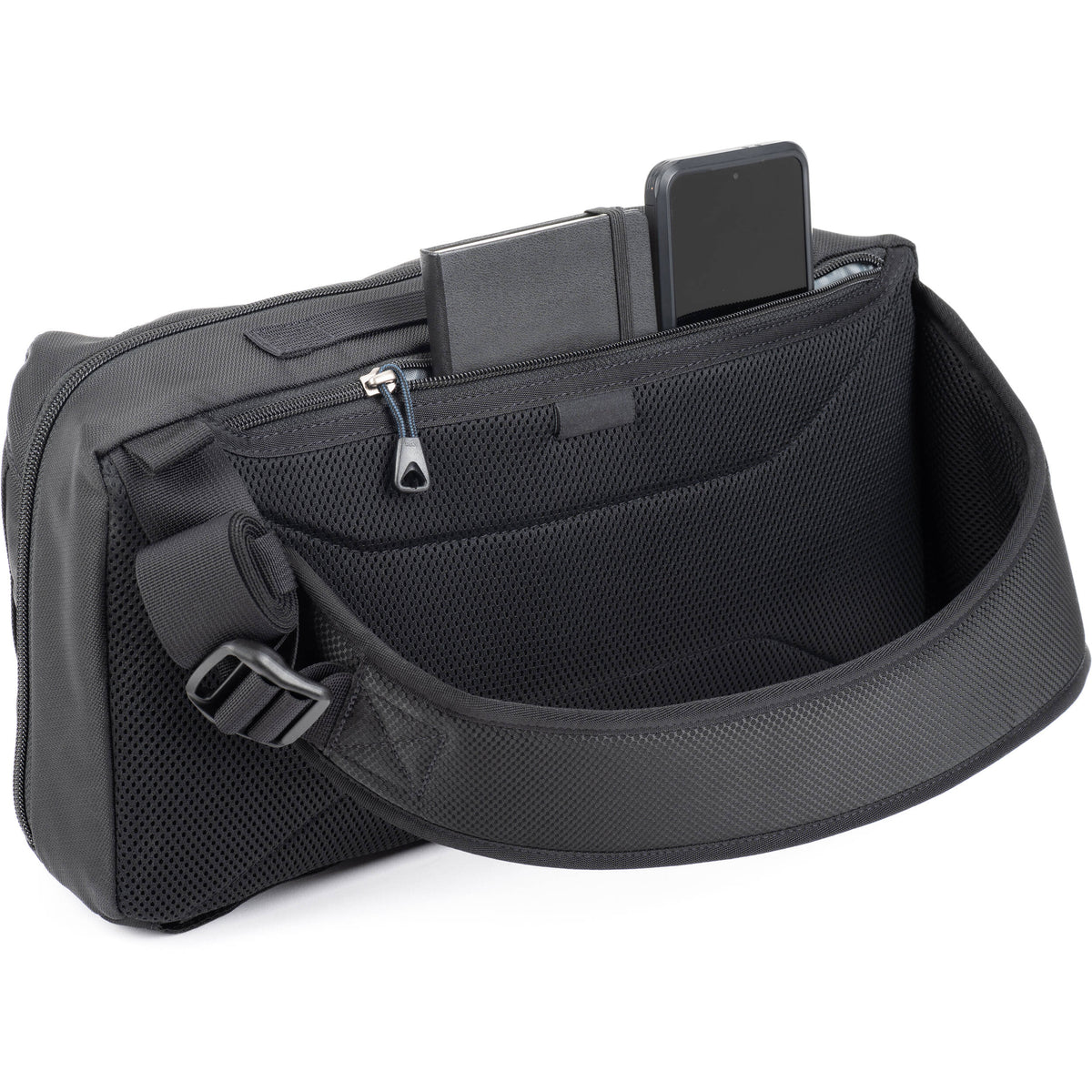 Think Tank PressPass Sling Bag for video equipment, black nylon with adjustable strap and multiple compartments.