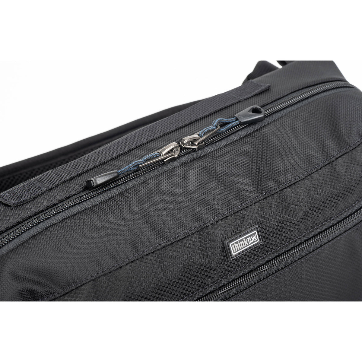 Think Tank PressPass Sling Bag for video equipment, featuring padded compartments and adjustable strap for comfortable carrying.