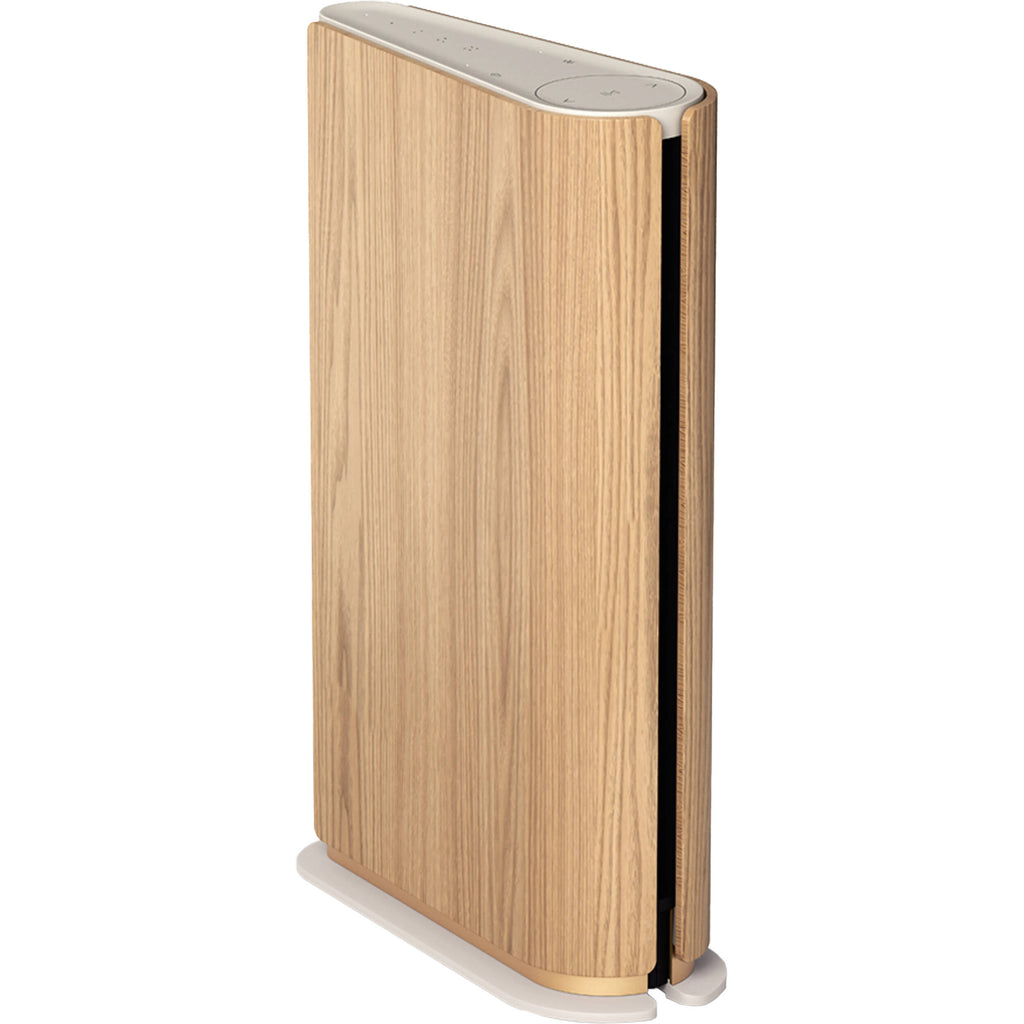 Bang & Olufsen Beosound Emerge wireless speaker in gold tone with sleek design and fabric covering.