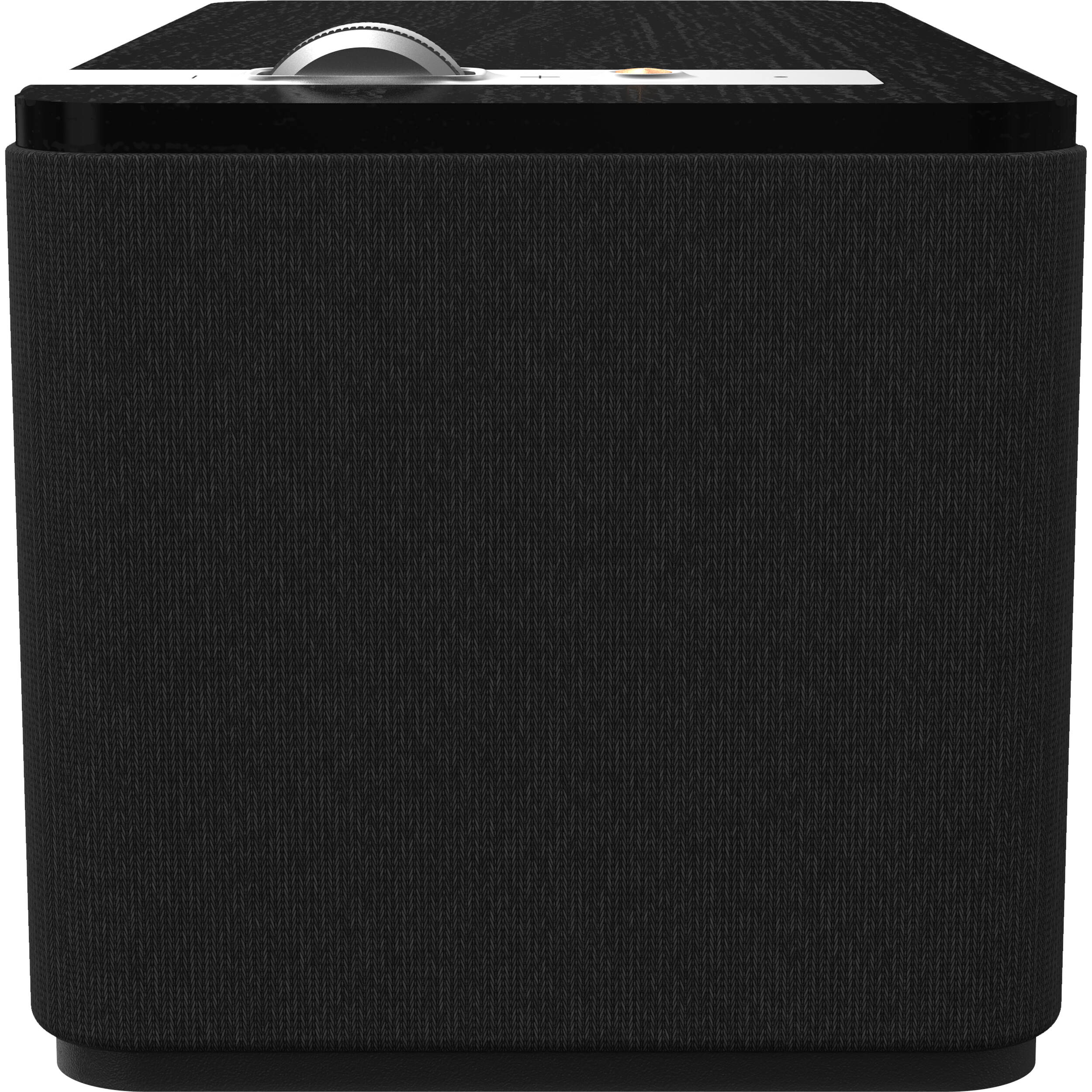 Klipsch The One Plus wireless speaker showing its compact design with a fabric grille and control buttons on top.